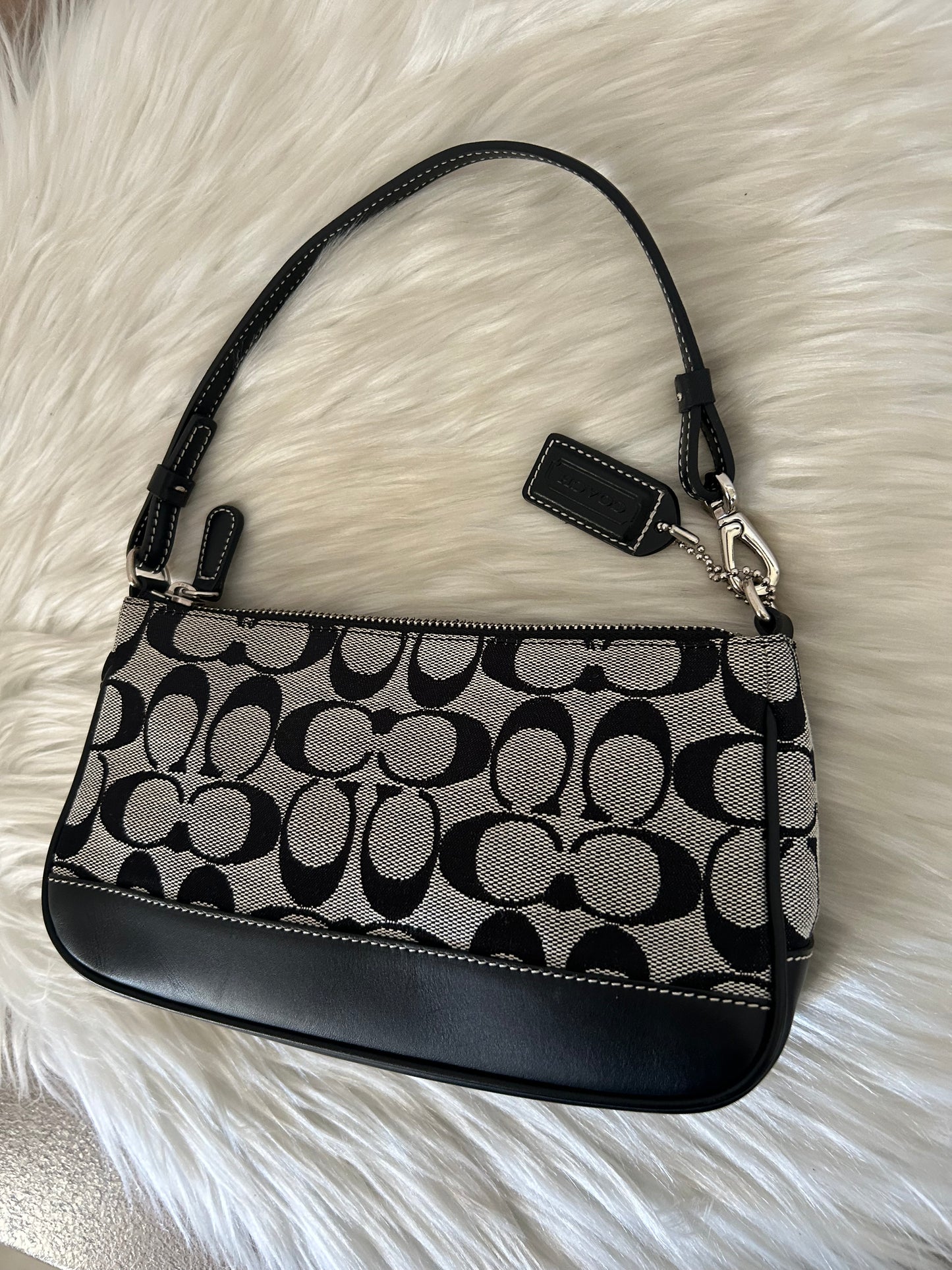 Coach baguette in monogram in tela e pelle