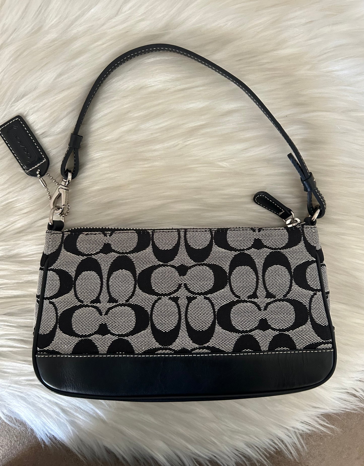 Coach baguette in monogram in tela e pelle