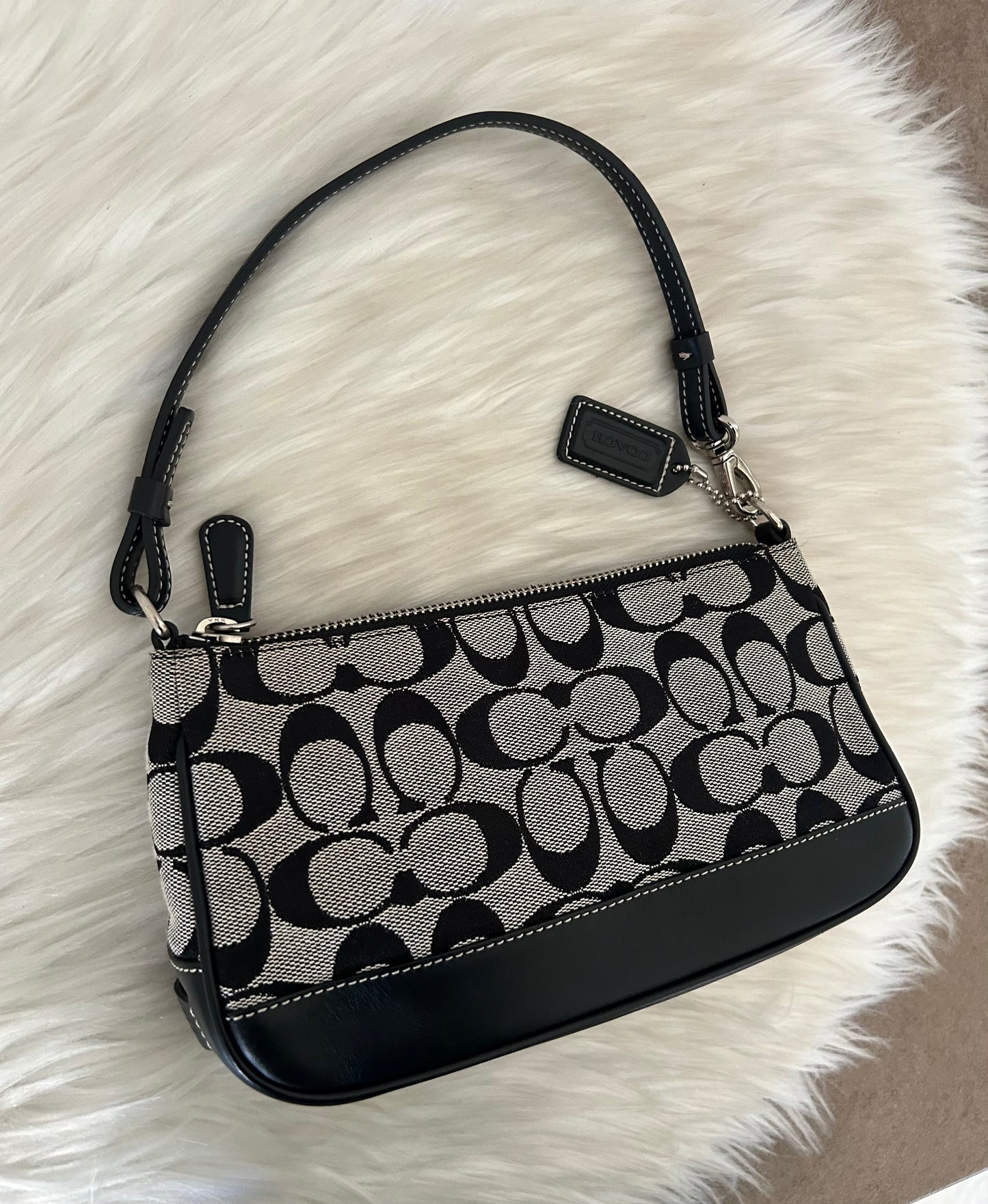 Coach baguette in monogram in tela e pelle