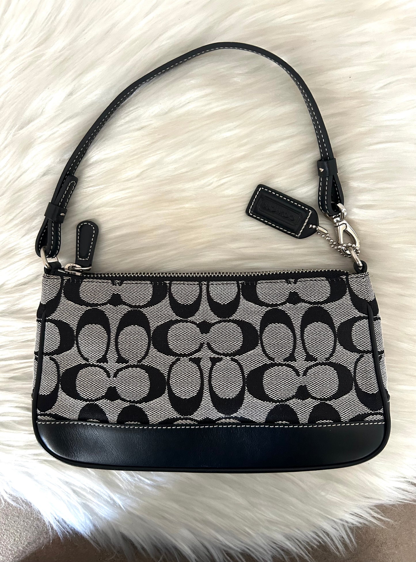 Coach baguette in monogram in tela e pelle