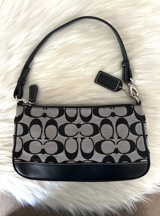 Coach baguette in monogram in tela e pelle